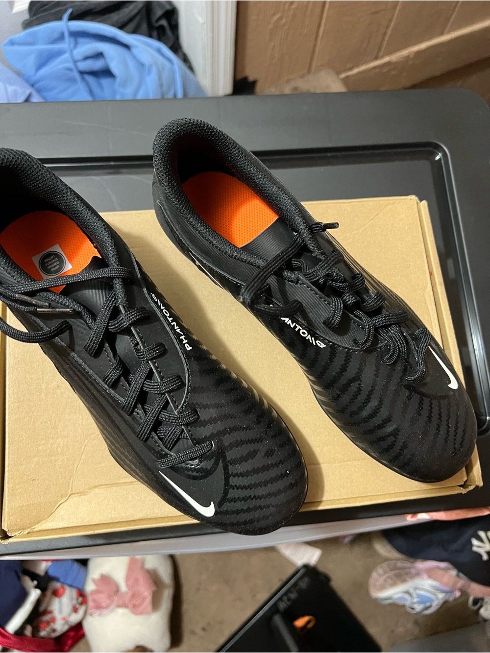 Nike Menβs Black Athletic Cleats with Orange Insole